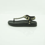 Yokono Black Leather Gold Pyramid Studded T-Bar Flat Sandal | MORENA-315